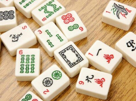 mah jongg tiles spread out on table