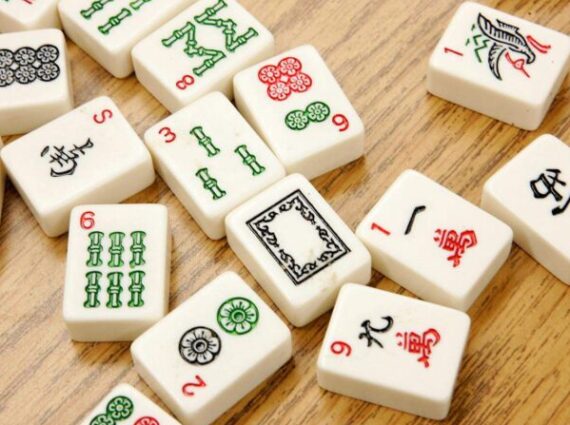 mah jongg tiles spread out on table