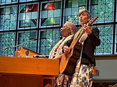 Cantor Bortnick plays guitar with Sabrina Sojourner singing