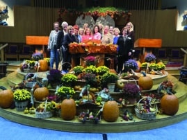 Women of WHC on the bima with fall decorations
